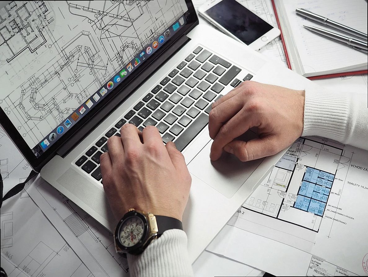 blueprints, entrepreneur, hands, laptop, macbook, mobile phone, notebook, schematics, working, planning, gray computer,